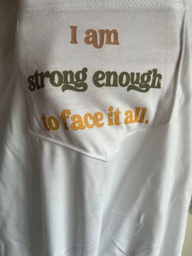 Oversized, pre tied pocket t shirt with I am Strong enough to face it all Size XS